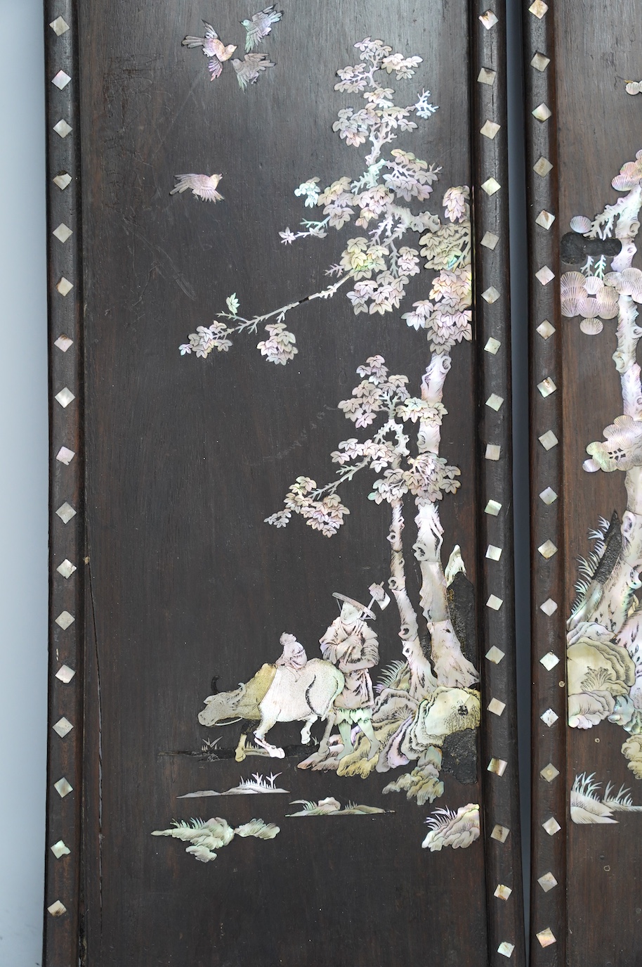 A pair of Chinese mother of pearl inlaid panels, 68 x 20cm. Condition - poor to fair